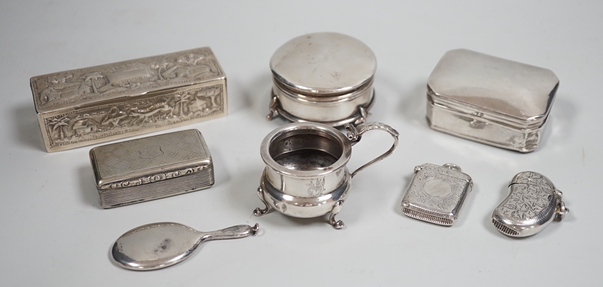 A collection of small silver items including two trinket boxes, a damaged mustard pot, two vesta case, snuff box etc. and a white metal box.